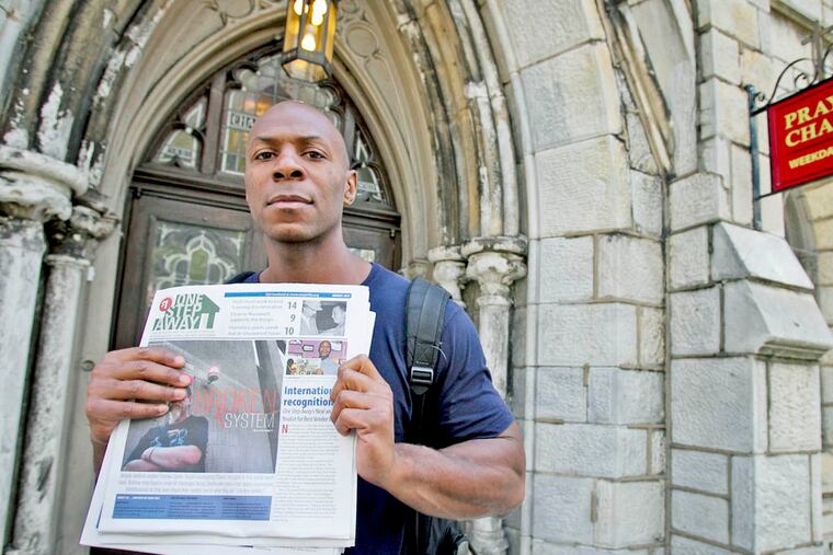 Neal McLaurin a newspaper vendor with One Step Away outside the Arch St United Methodist Church at N. Broad and Arch St. in Philadelphia. He is currently studying acting at Community College of Philadelphia. ( ALEJANDRO A. ALVAREZ / STAFF PHOTOGRAPHER )
