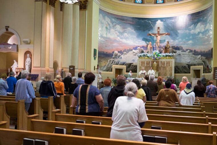 St. Edmond Church, at 21st and Snyder in South Philadelphia, one of 16 parishes scheduled to close and merge with others. St. Edmond will merge with St. Monica, but the church will stay open for weekend services.(ED HILLE / Staff Photographer)