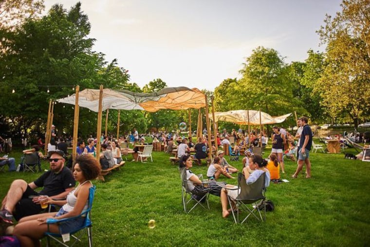 Guests of Parks on Tap group together in circles in a park during the garden social hour.