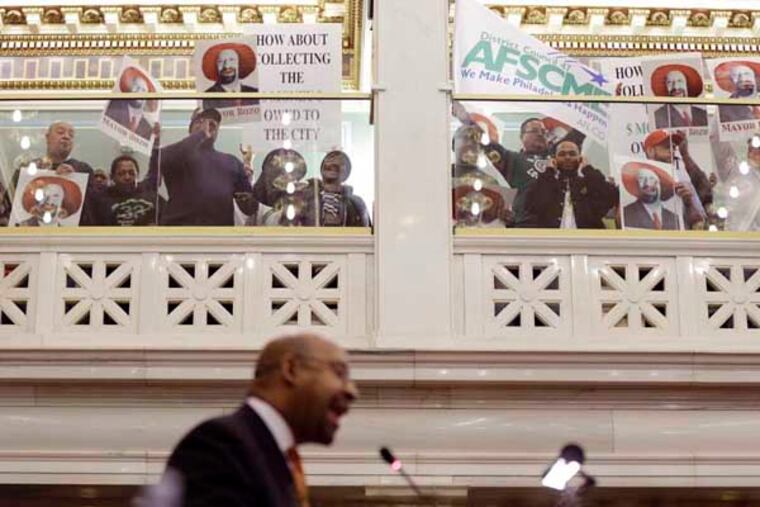 Mayor Michael Nutter attempts to delivers his budget address to city council at City Hall, Thursday, March 14, 2013, in Philadelphia. Deafening protests have forced Philadelphia Mayor Michael Nutter to abandon his traditional budget address in mid-speech. (AP Photo/Matt Rourke)