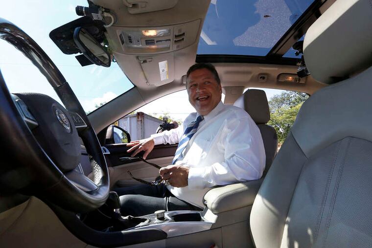 U.S. Rep. Bill Shuster in a self-driven Cadillac SRX that was modified by Carnegie Mellon University.