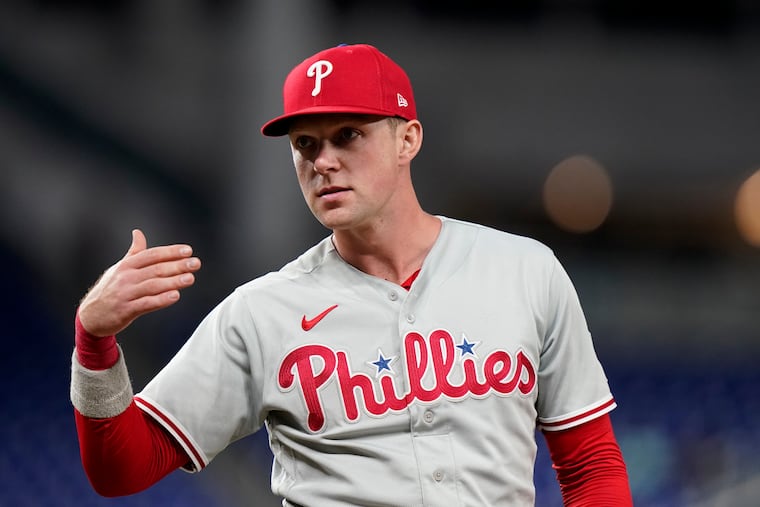 Philadelphia Phillies first baseman Rhys Hoskins gestures during the seventh inning of a baseball game against the Miami Marlins, Tuesday, Sept. 13, 2022, in Miami. The Phillies won 2-1. (AP Photo/Lynne Sladky)