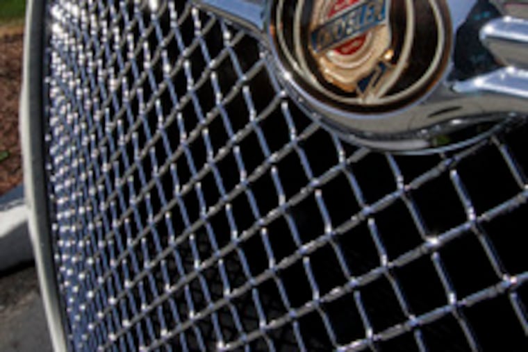 Part of the distinctive front grille of a Chrysler vehicle at a dealership. The automaker soon will be independent again.