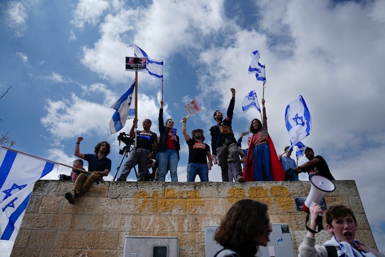 Israelis protest against Prime Minister Benjamin Netanyahu's judicial overhaul plan outside the parliament in Jerusalem on Monday.