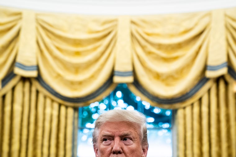 President Trump listens during a ceremony to award the Presidential Medal of Freedom to Edwin Meese III in the Oval Office at the White House.