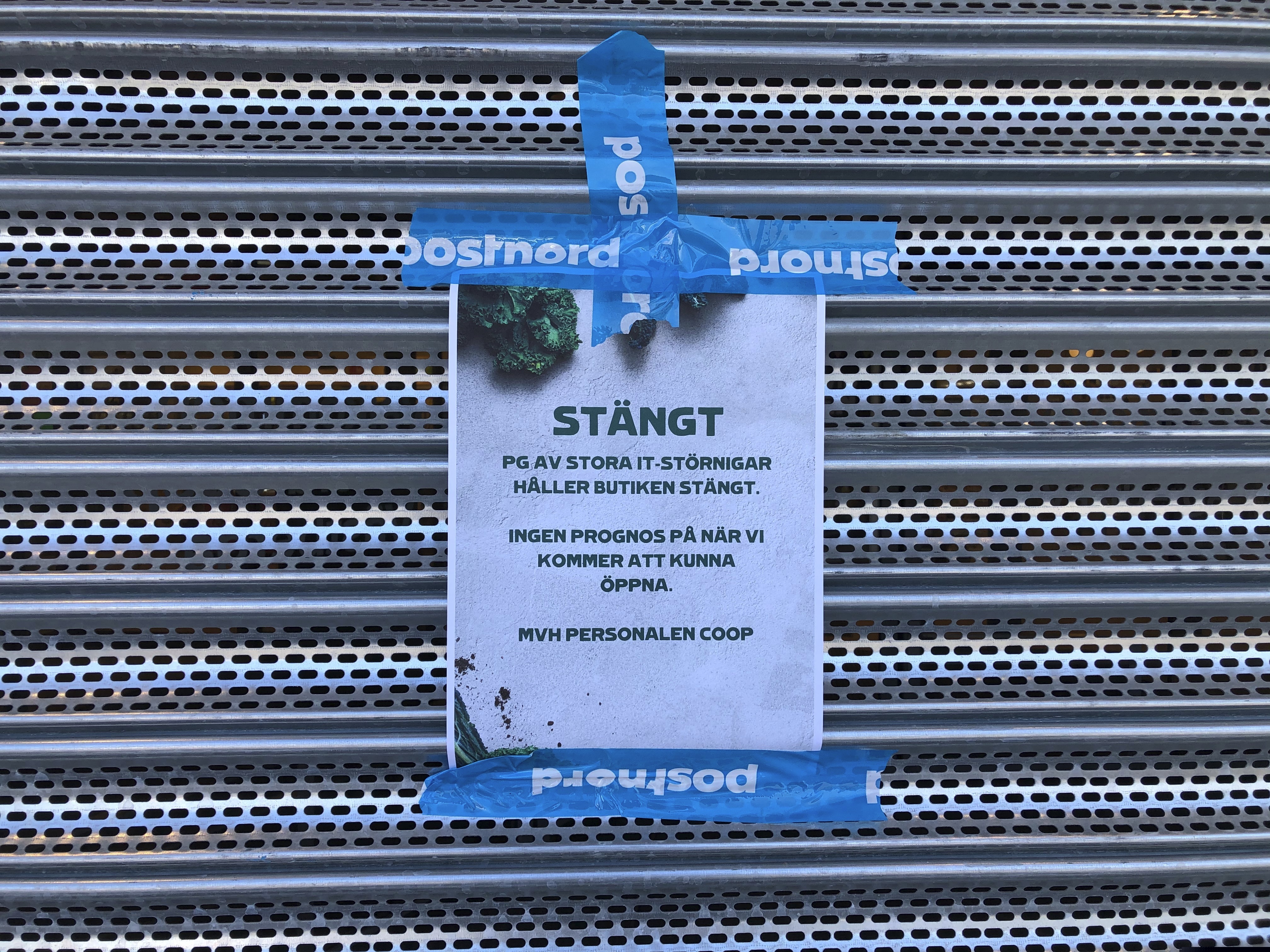 A sign that reads: "Coop Forum supermarket in Vastberga is closed due to IT disturbances, no prognosis as to when we will open again," on a closed Coop supermarket store in the suburb of Vastberga, Stockholm, Sweden, on Saturday.