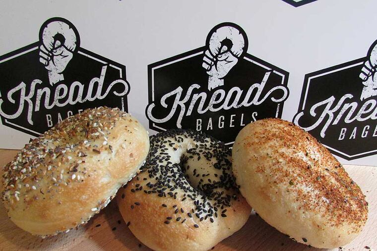 An everything bagel (left), black sesame bagel (center) and togarashi bagel at Knead Bagels, 725 Walnut St.