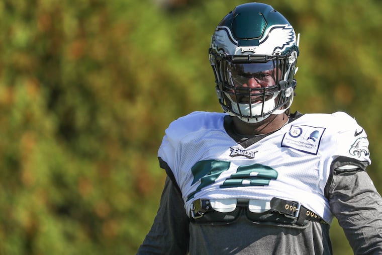 Eagles defensive tackle Albert Huggins (78) does stretches during his first day of practice at the NovaCare Complex in South Philadelphia on Wednesday, Oct. 23, 2019.