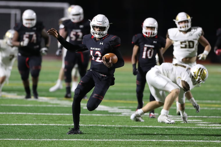 Imhotep Charter's Jalen Sutton-Christian runs for a long gain in last Friday night's 41-6 win over Bethlehem Catholic in a PIAA Class 4A football semifinal.