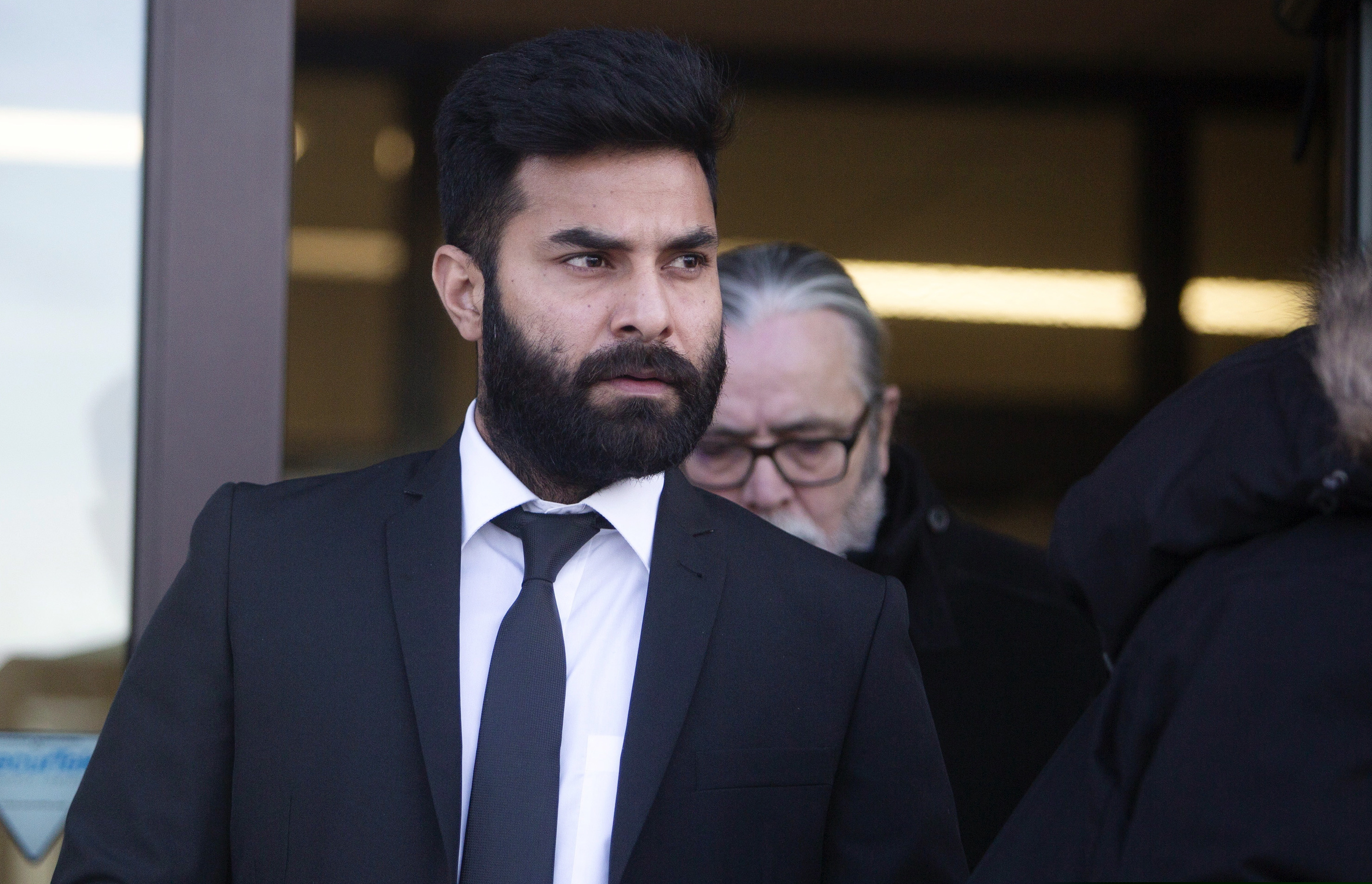 Jaskirat Singh Sidhu leaves provincial court in Melfort, Saskatchewan, Tuesday, Jan. 8, 2019. Sidhu, the driver of a transport truck involved in a bus crash that killed 16 people with the Humboldt Broncos junior hockey team in Canada last year has has pleaded guilty to all charges against him. Sidhu was charged with 16 counts of dangerous driving causing death and 13 charges of dangerous driving causing bodily harm.