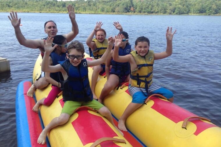 Camp Nah-Jee-Wah in Milford, Pike County, where the Joshkowitz family vacationed last summer. Dad Scott (in back) and son Jacob (in glasses, front left) joined kids from other families.