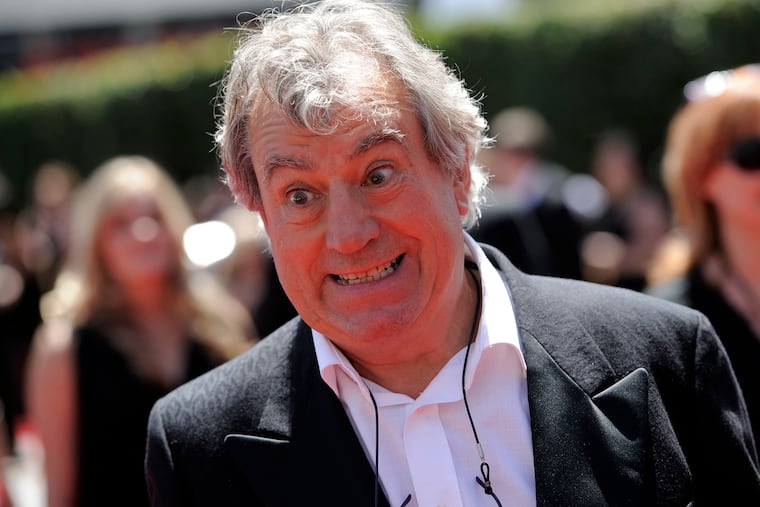 Terry Jones arrives at the Creative Arts Emmy Awards in Los Angeles. Terry Jones, a member of the Monty Python comedy troupe, has died at 77. Jones's agent says he died Tuesday Jan. 21, 2020.