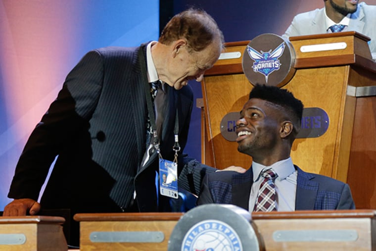 Minnesota Timberwolves owner Glen Taylor, left, talks with 76ers' Noel Nerlens before the NBA basketball draft lottery Tuesday, May 19, 2015, in New York. (AP Photo/Julie Jacobson)