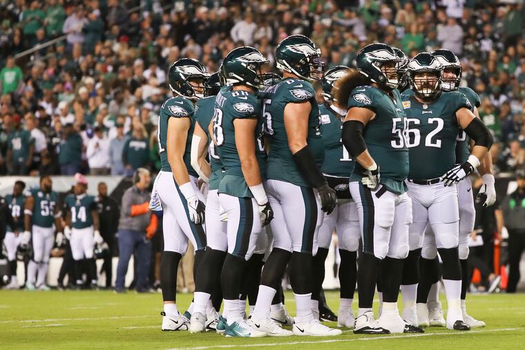 The Eagles offense waits for the start of play during the Sunday night win against the Dallas Cowboys.