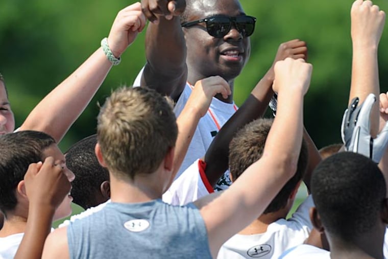 Eagles wide receiver Jeremy Maclin directs some of the eager kids at
his youth football camp at RiverWinds Community Center in West
Deptford on June 25, 2013. (Clem Murray/Staff Photographer)