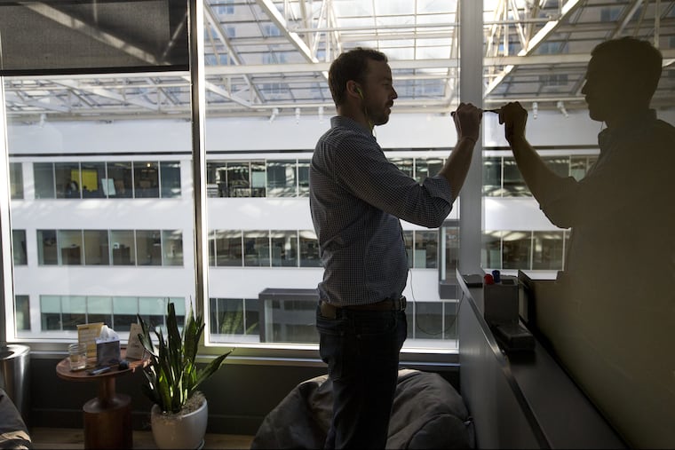 Wework offers Co-working sites — where folks collaborate on startups . The comon areas offer the benefits of bigger offices. Tom Callen of Dayblink Consulting works in one of the common conference rooms on the 8th floor on Feb. 21, 2018.