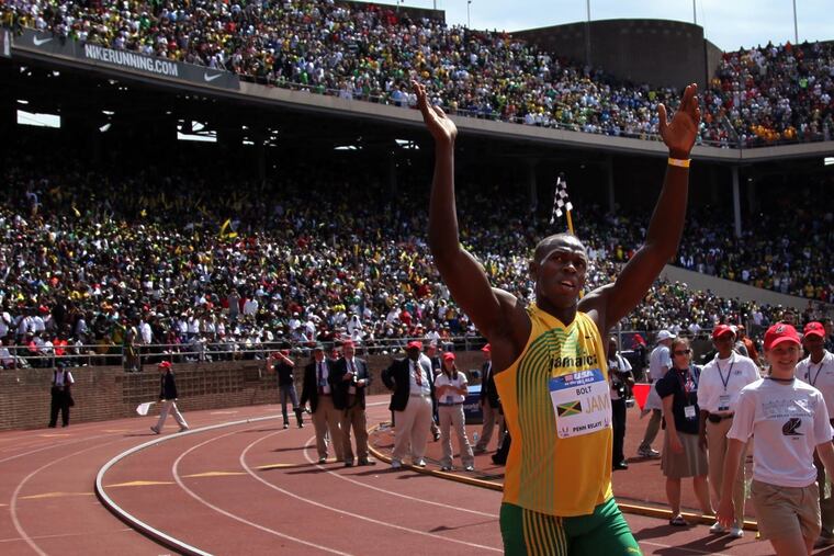 Usain Bolt waves to fans at Franklin Field after the 4x100 men's relay in the USA vs. the World competition at the Penn Relays in 2010.