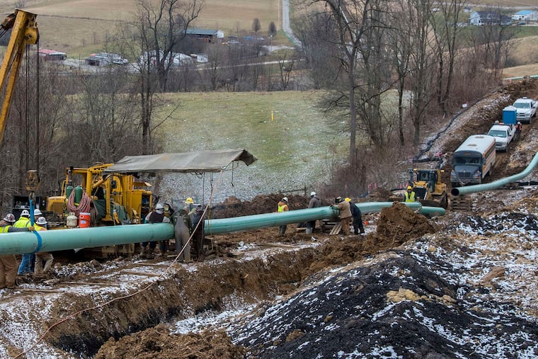 Workers install the Mariner East 2 pipeline in Pennsylvania in 2018. The PennEast Pipeline, which would connect Pennsylvania and New Jersey, is subject of a legal dispute that was argued Wednesday before the U.S. Supreme Court.