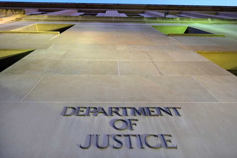 The Department of Justice headquarters building in Washington is photographed early in the morning.