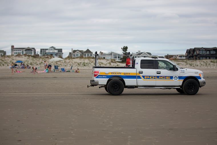 Ocean City Police Truck drives along the shore as families enjoy the weather on Saturday. Ocean City is one of few beach’s doing a “dry run” to test “capacity management this weekend in preparation for Memorial Day.