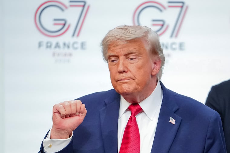 U.S. President Donald Trump gestures as he leaves the stage after a media conference at the end of the G7 summit in Evian-les-Bains, France, Wednesday.