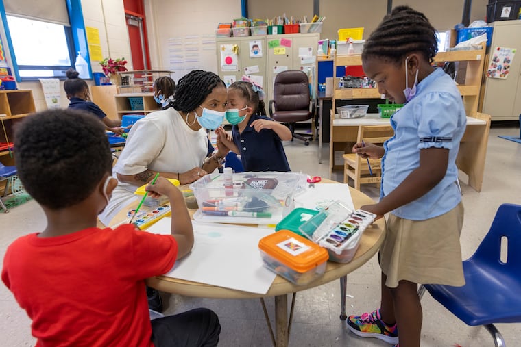 Art teacher Jamila Roy with students at Yorkship Elementary School in Camden.