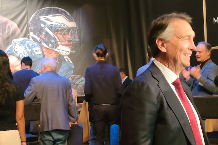 Saquon Barkley looms in the backround as NBC's Cris Collinsworth speak to reporters at a media event in New York City on Wednesday, Jan. 7, 2026.