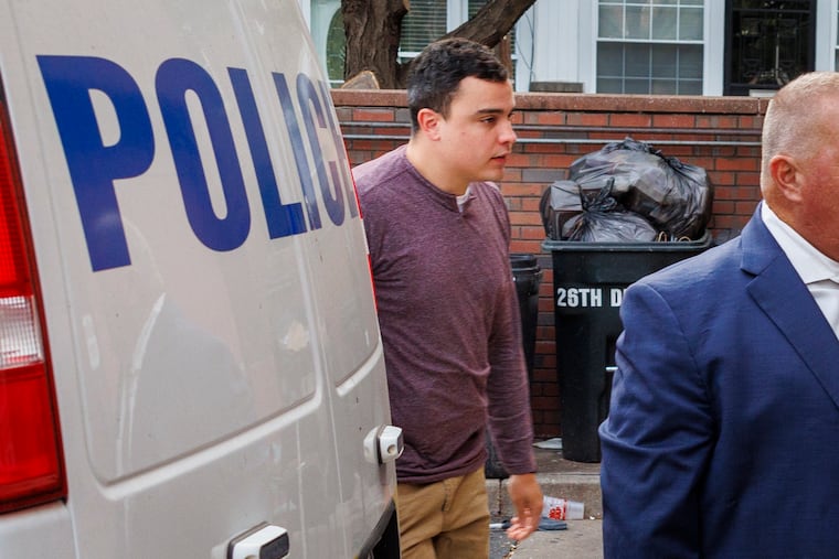 Philadelphia police officer Mark Dial surrenders at the 1st Police District in South Philadelphia on Friday, Sept. 8. He faces murder charges in the fatal shooting of Eddie Irizarry.