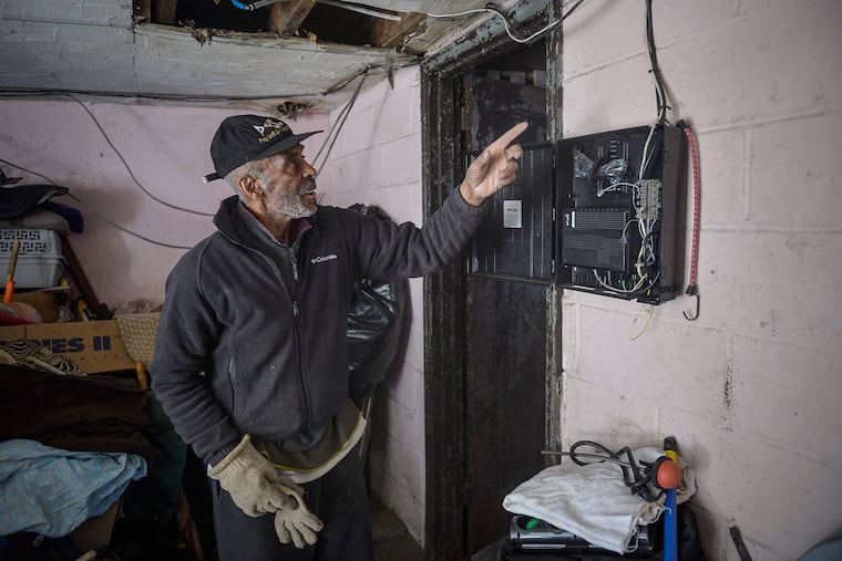 James LaRoy, 83, says Verizon installed this fiber box in his garage, damaging the garage door.