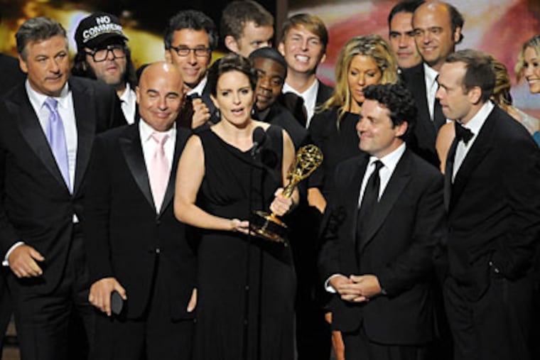 The cast of “30 Rock” accept the award for best comedy series at the 61st Primetime Emmy Awards on Sunday, Sept. 20, 2009, in Los Angeles. (AP Photos/Mark J. Terrill)