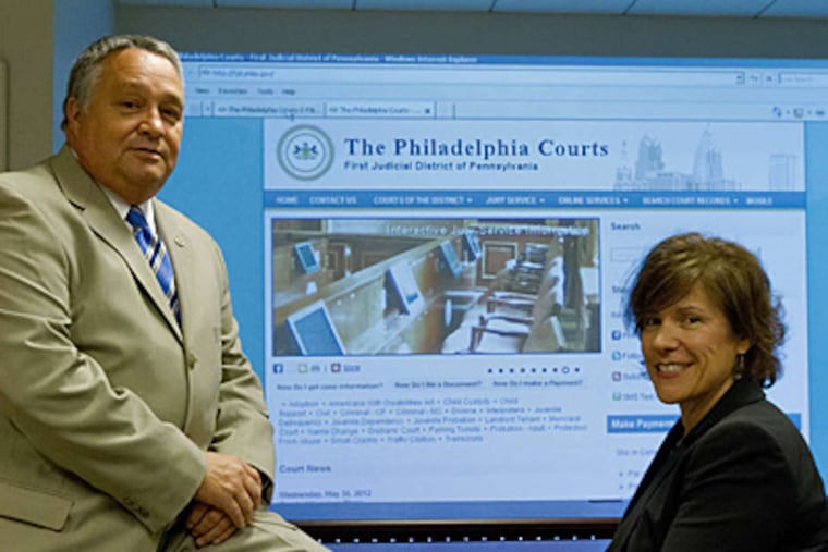 Court Clerk Joseph H. Evers and Court Deputy Clerk Deborah E. Dailey. "As you can see, we're very enthusiastic," Evers said. "I think in two years we've done a remarkable job." (David M Warren/Staff)