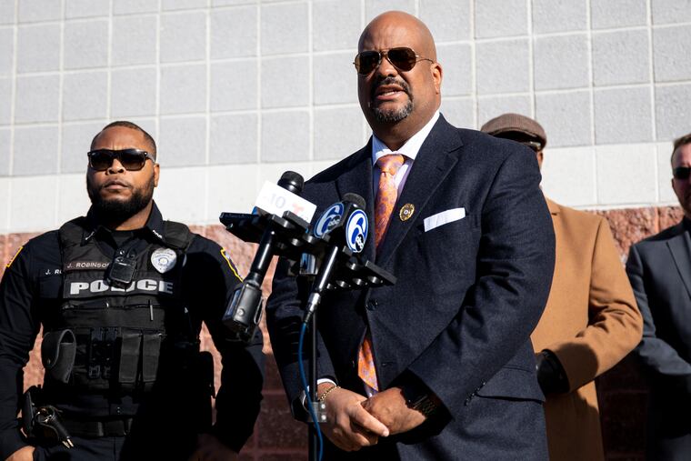 This November 2019 photo shows Atlantic County prosecutor Damon Tyner (right).