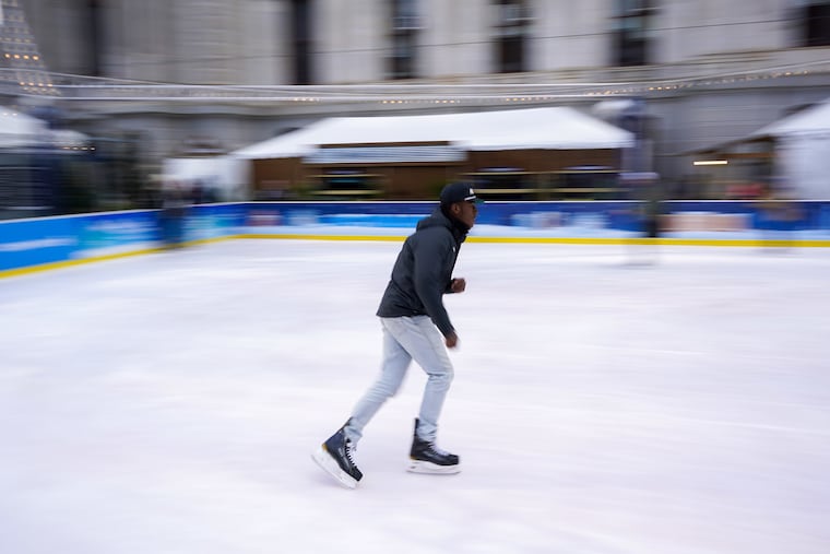Seth Agwunobi, a Temple University senior, skates at Rothman Orthopaedics Ice Rink at City Hall in Philadelphia