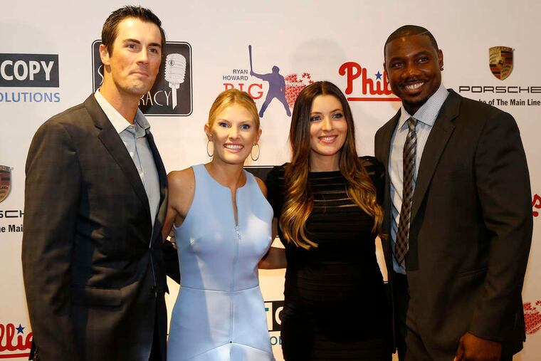 PHOTOS: YONG KIM / STAFF PHOTOGRAPHERBatting for literacy Above, Cole Hamels (left) and wife Heidi join Ryan Howard and his wife, Krystle, for Howard's annual Stand Up for Literacy fundraiser yesterday at the Franklin Institute. At left, Howard and Phillies teammate Darin Ruf meet up for the event. The Ryan Howard Big Piece Foundation promotes academic and athletic development for children.