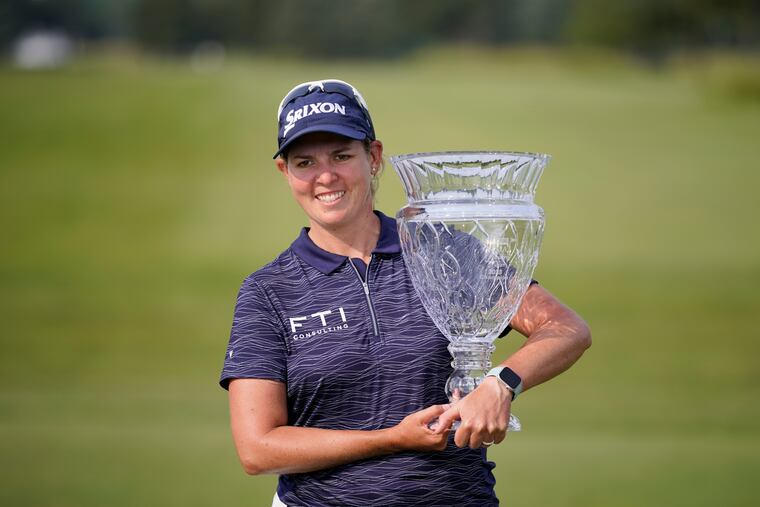 Ashleigh Buhai, of South Africa, poses with the trophy after winning the ShopRite LPGA Classic golf tournament, Sunday, June 11, 2023, in Galloway, N.J. (AP Photo/Matt Slocum)