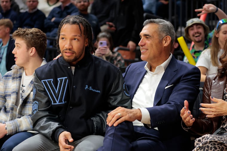 Former Villanova coach Jay Wright (right) was correct in his evaluation that Jalen Brunson (left) could be a point guard on an NBA title team. But “I didn’t think he would be the guy that would score 45,” Wright said.