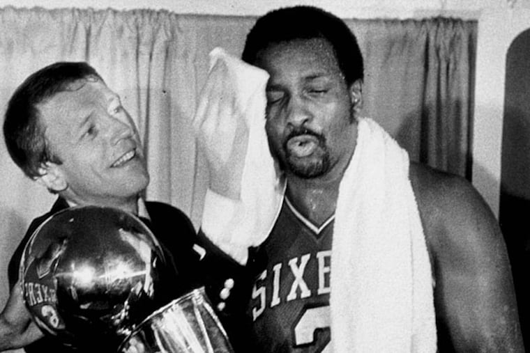 Sixers head coach Billy Cunningham and Moses Malone after Sixers championship win in 1983.