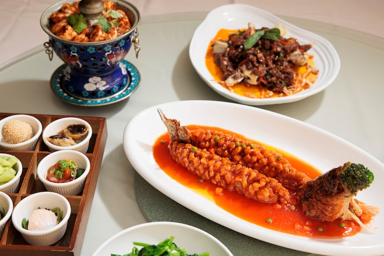 The dim sum platter box, black pepper shrimp, the fried branzino and cumin spicy lamb shank at Peter Chang King of Prussia on Thursday, Feb. 19, 2026 in King of Prussia, Pa