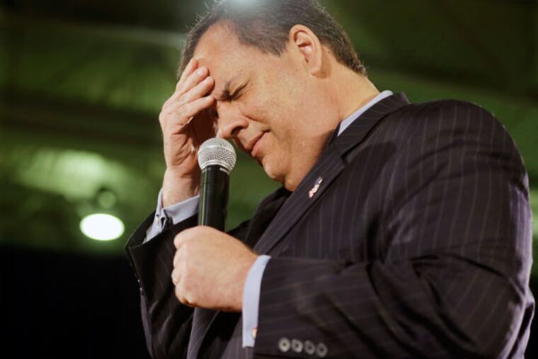 Gov. Christie winces after he got the day of the week wrong during his town-hall meeting. He said it was Wednesday. He was headed to Boston later in the day for a fund-raiser. (AP)