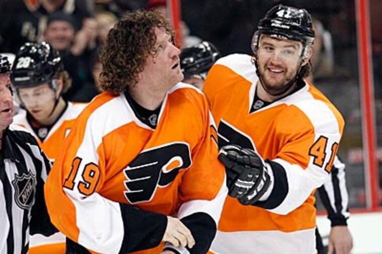 After scoring a goal, Scott Hartnell and Dion Phaneuf dropped the gloves. (Yong Kim/Staff Photographer)