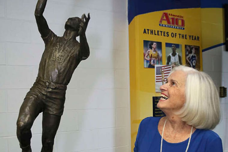 Caroline Gola delights in the sculpture of her late husband, Tom. (Joseph Kaczmarekk/For the Daily News)