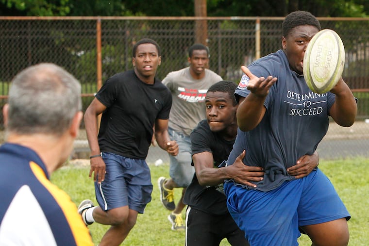 The Nomads is a new film inspired by the North Philly Nomads, an unlikely rugby team made up of Philadelphia School District players. Director Brandon Eric Kamin discovered the team through a 2014 Inquirer story. In this file photo of the Nomads team, Tyquise Edgerson tries to make a pass to Coach Larry Conlan as he is tackled by Jamal Sherman.