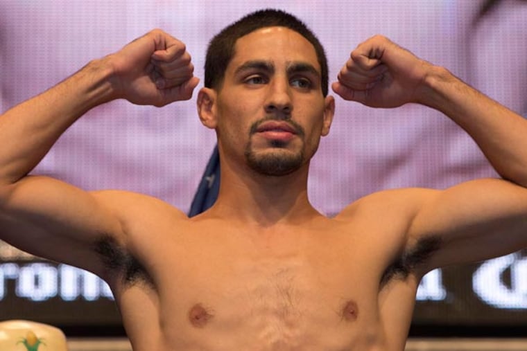 Danny Garcia poses for photos during the weigh-in for his Saturday boxing bout against Lucas Matthysse, Friday, Sept. 13, 2013, in Las Vegas. (Julie Jacobson/AP)