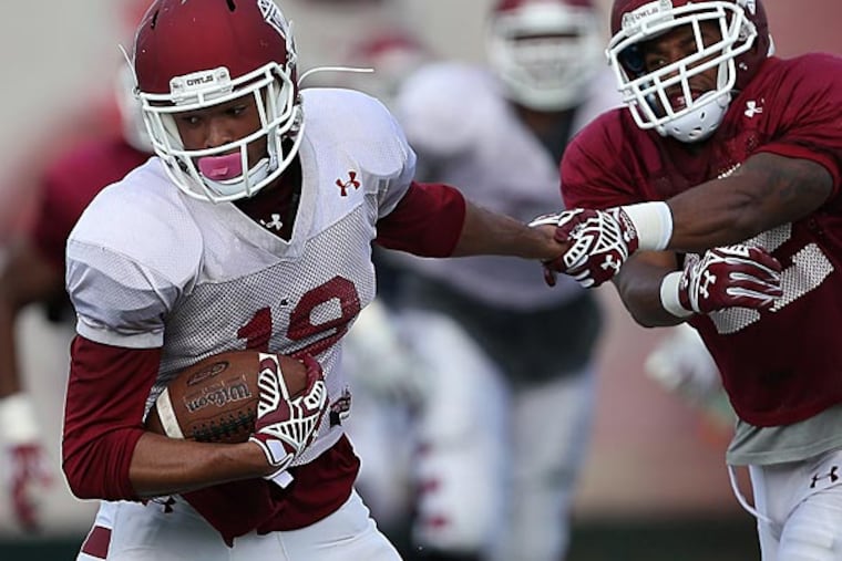 Keith Kirkwood (left) catches a pass during a Temple practice. (David Maialetti/Staff Photographer)
