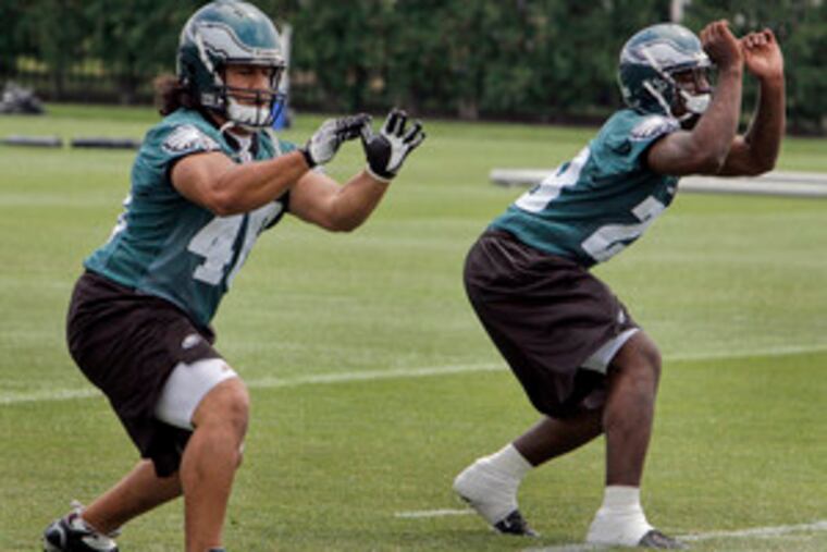 "Right now, the biggest thing to worry about is learning the offense," says rookie running back Tony Hunt (right), who joined fellow draftee Nate Ilaoa in a training drill yesterday.