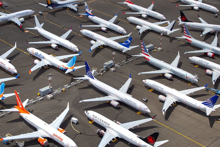 Boeing 737 MAX airplanes are parked along the west side of Boeing Field in Seattle.