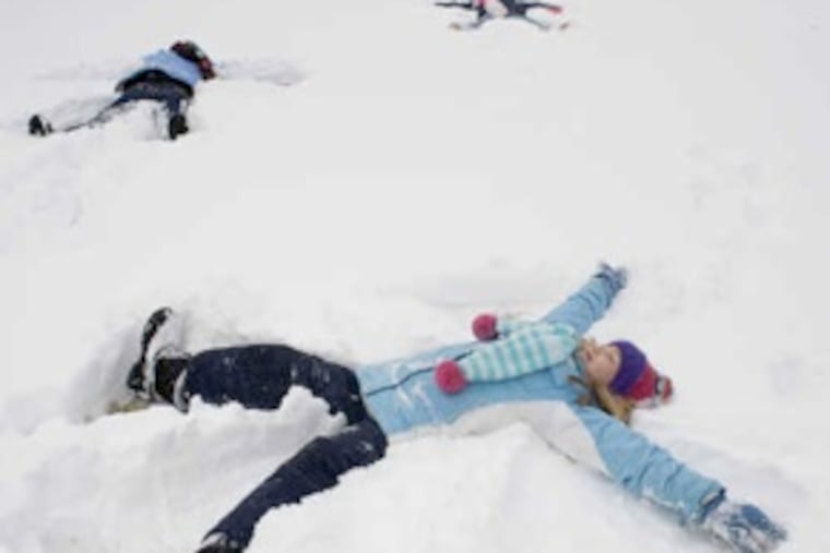 Angels take wing on a white-magic palette in Ardmore: Caitlin Kwapinski, with Allison Zarella and (rear) Caroline Kwapinski. (Ed Hille / Staff Photographer)