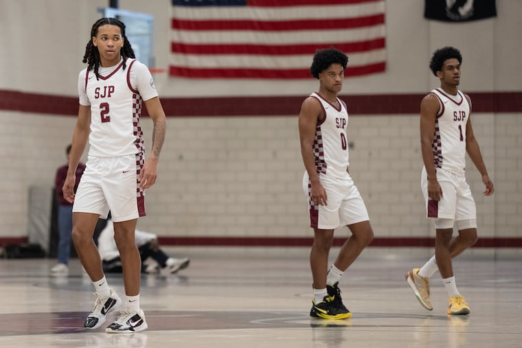 St. Joseph's Prep standouts (from left) Jordan Ellerbee, Olin Chamberlain, and Jaron McKie enter the court during a home game against Neumann Goretti on Monday.