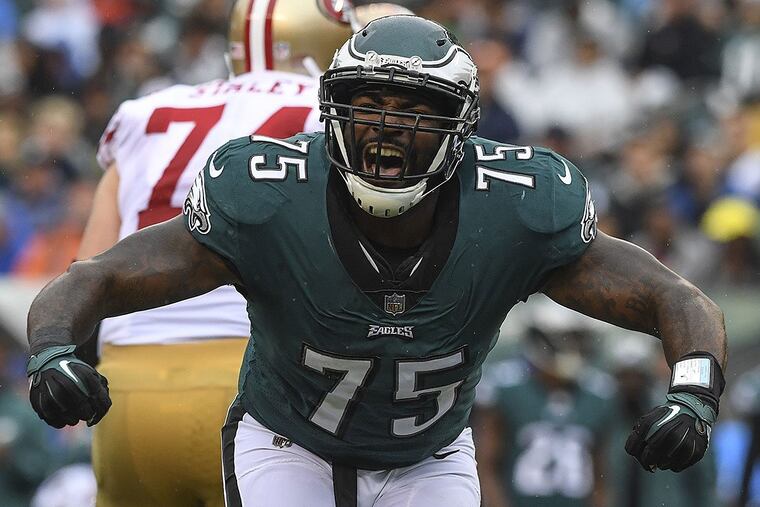 Eagles defensive end Vinny Curry celebrates his stop for a loss of San Francisco running back Carlos Hyde.