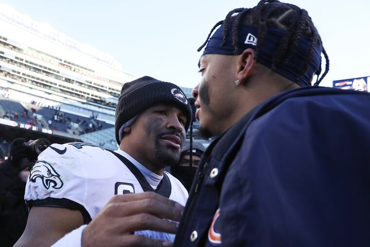 Eagles quarterback Jalen Hurts meets with Chicago Bears quarterback Justin Fields on Dec. 18, 2022.